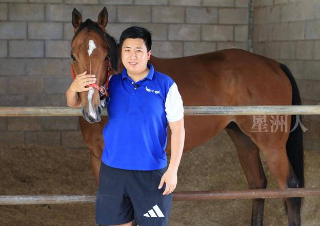 Trainer HY Cheng with a horse at the stable